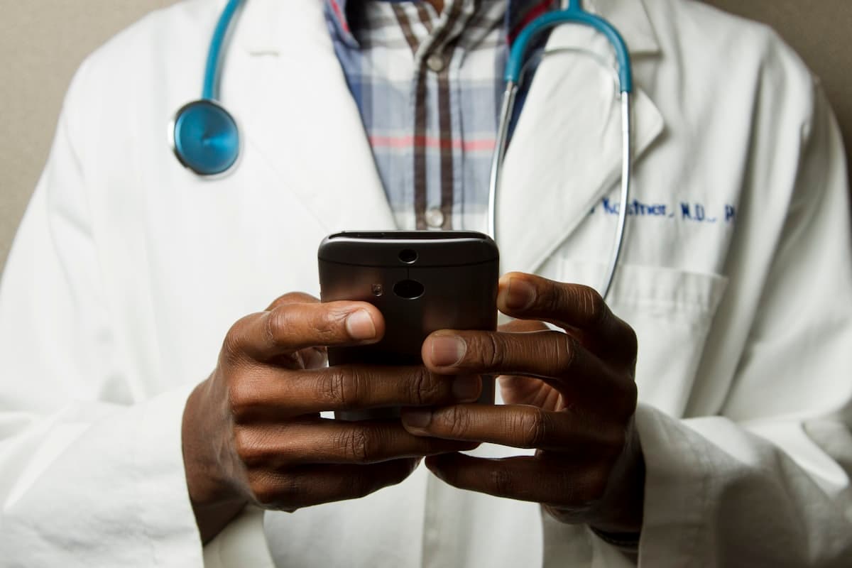 Healthcare professional reviewing patient information on a tablet